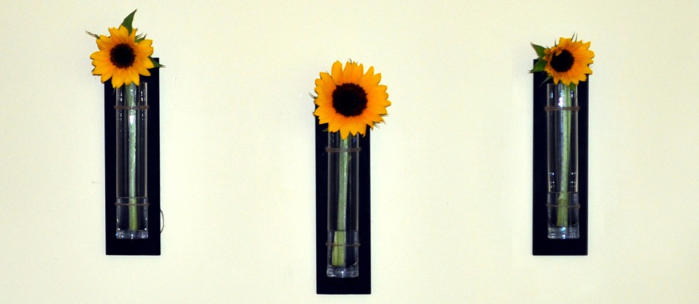 Hanging vases with sun flowers 