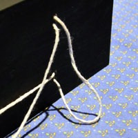Thread string for hanging vase