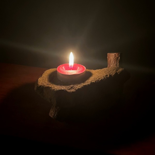 Sandstone and Eucalyptus Single Candle holder with candle burning